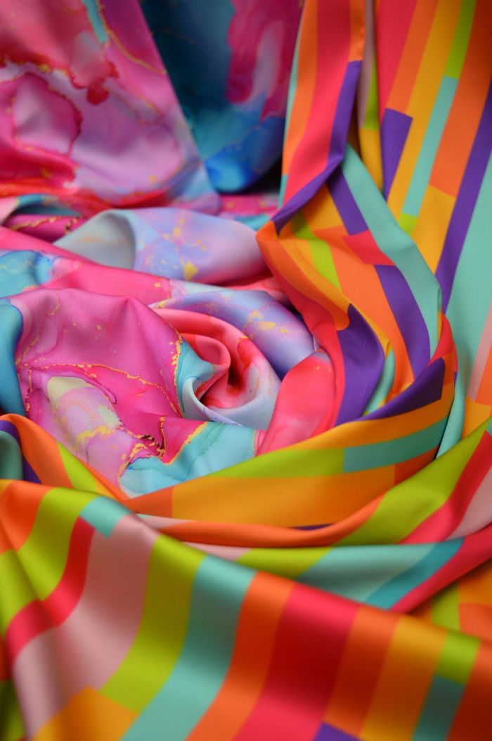 Colorful abstract fabric showcasing a mix of vibrant stripes and patterns.